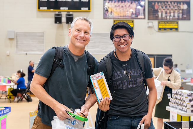 CHHS-5912-Enhanced-NR Teacher and Student picking up supplies at the Teacher Supply Store